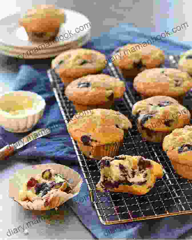 A Freshly Baked Batch Of Blueberry Muffins With Golden Brown Tops Happiness Baking: Pies Cakes Muffins Tarts Brownies Cookies: Favorite Desserts